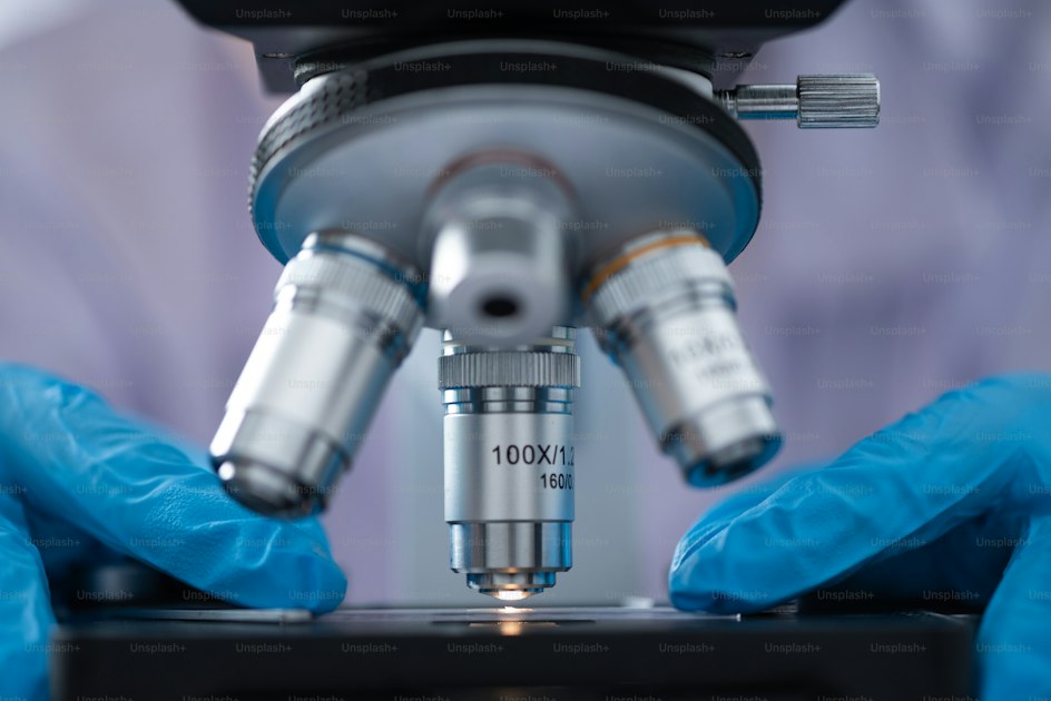 Close-up of a microscope lens in a laboratory