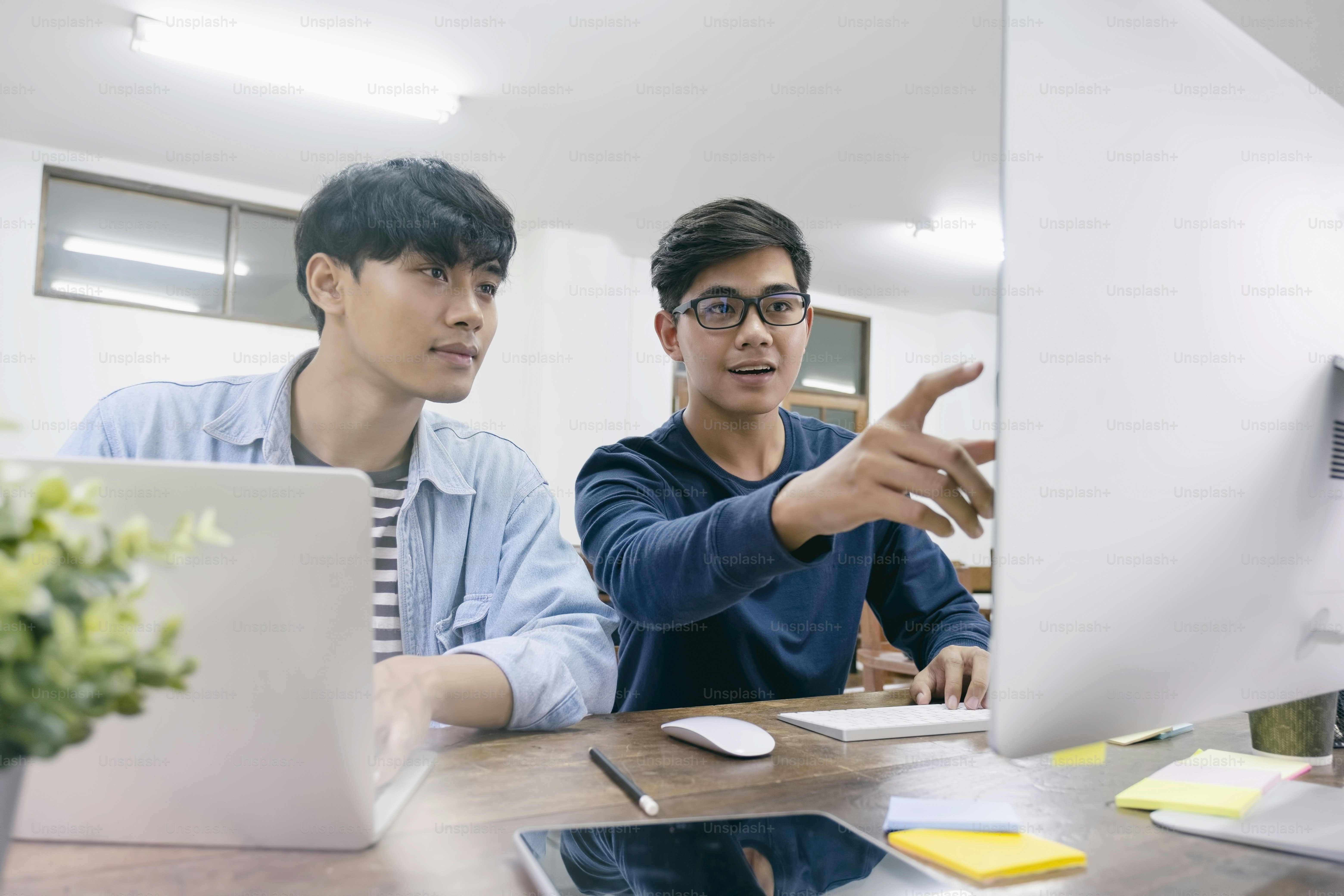 Programmers and developer teams are coding and developing software ...