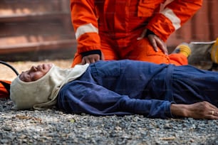 Medium shot of firefighter in fire suit on safety rescue duty help a man inside burning premises by first aid emergency. Safety, rescue and health care concept.