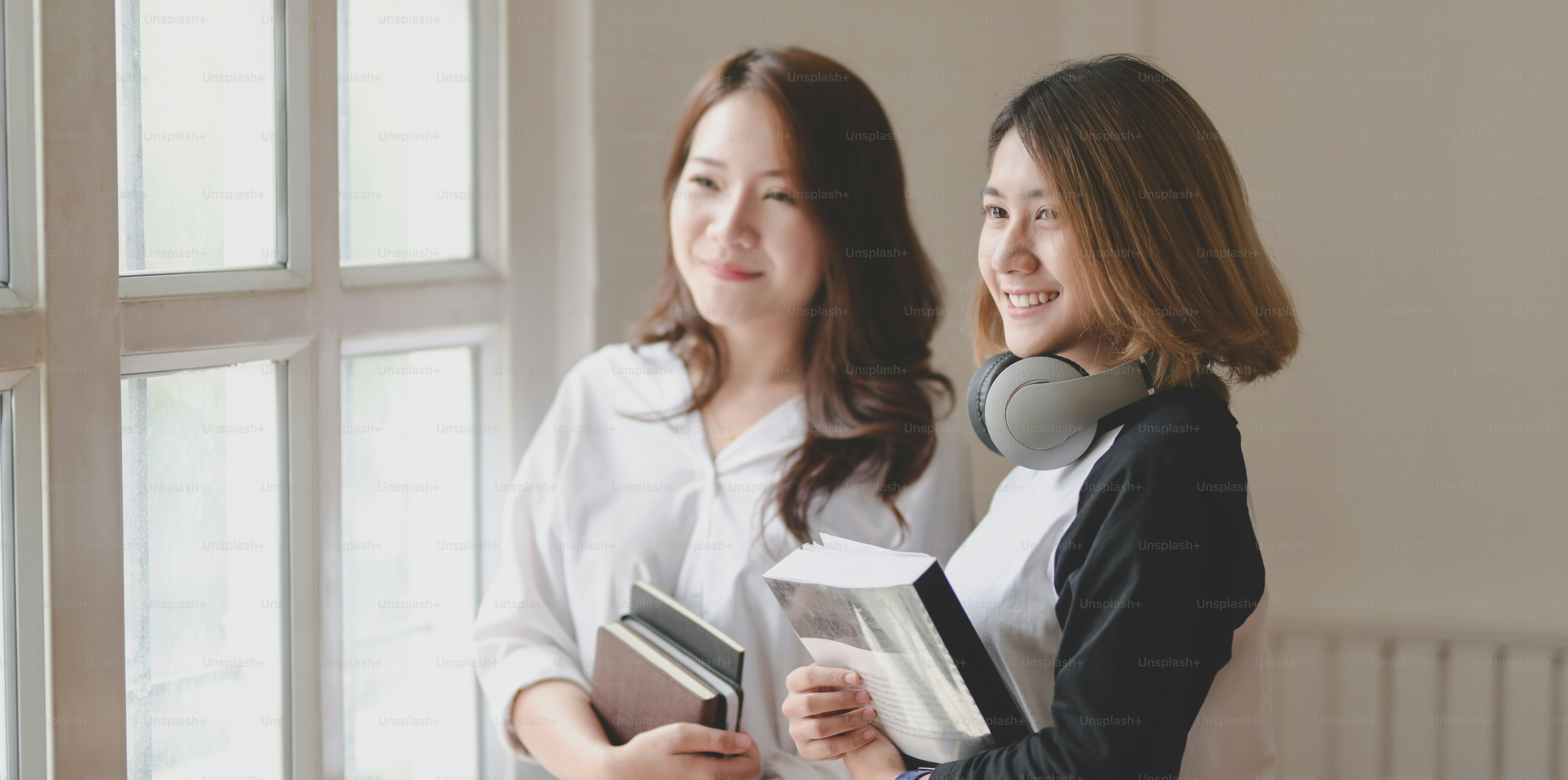 Portrait of two businesswoman looking of the windows in modern comfortable room