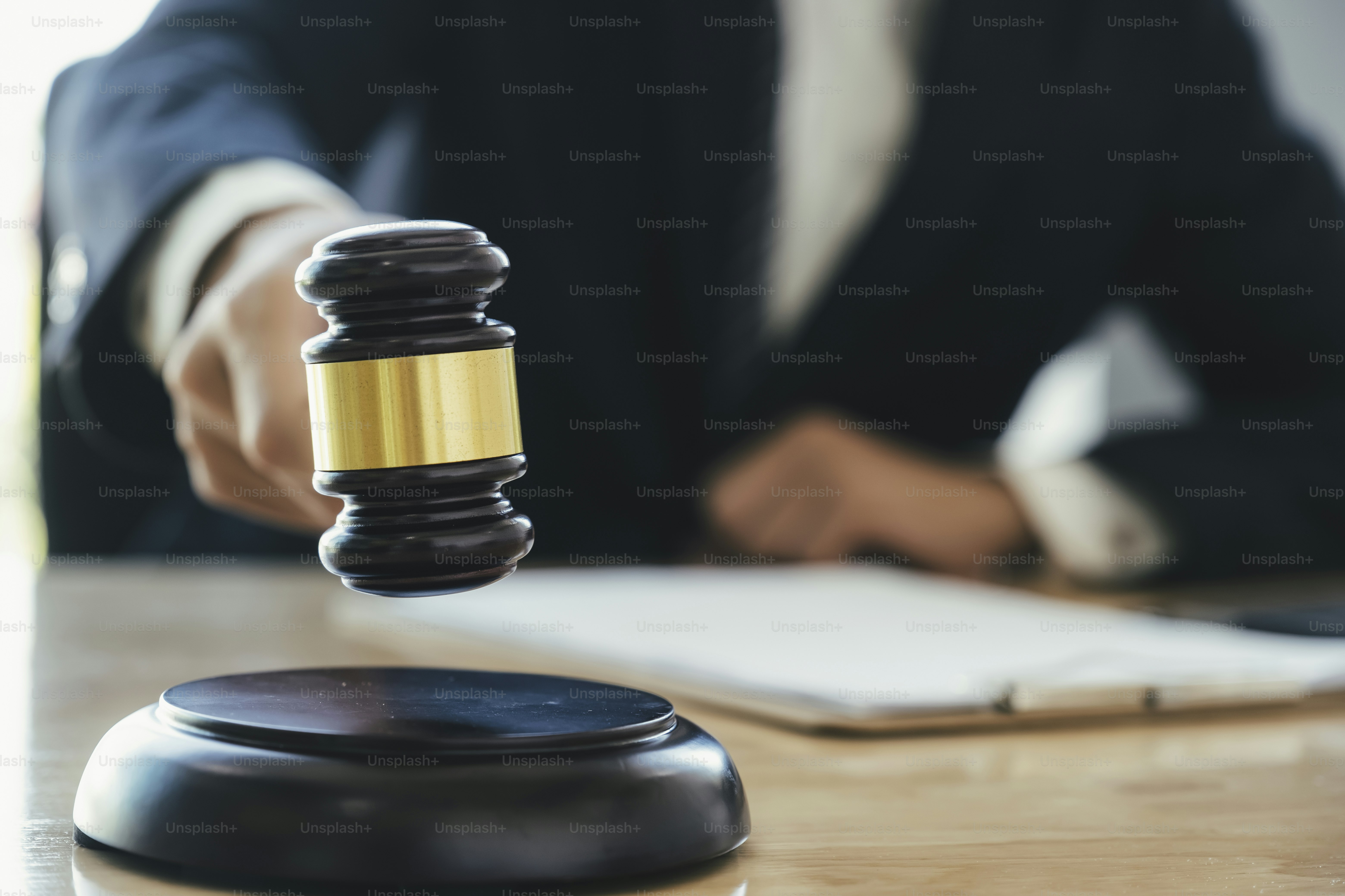 Justice and lawfirm concept. Male lawyer in the office with brass scale