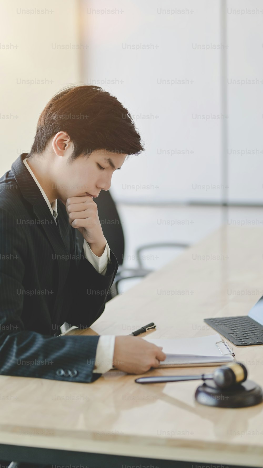 Legal services concepts : Lawyer working on a laptop and providing legal document for his client