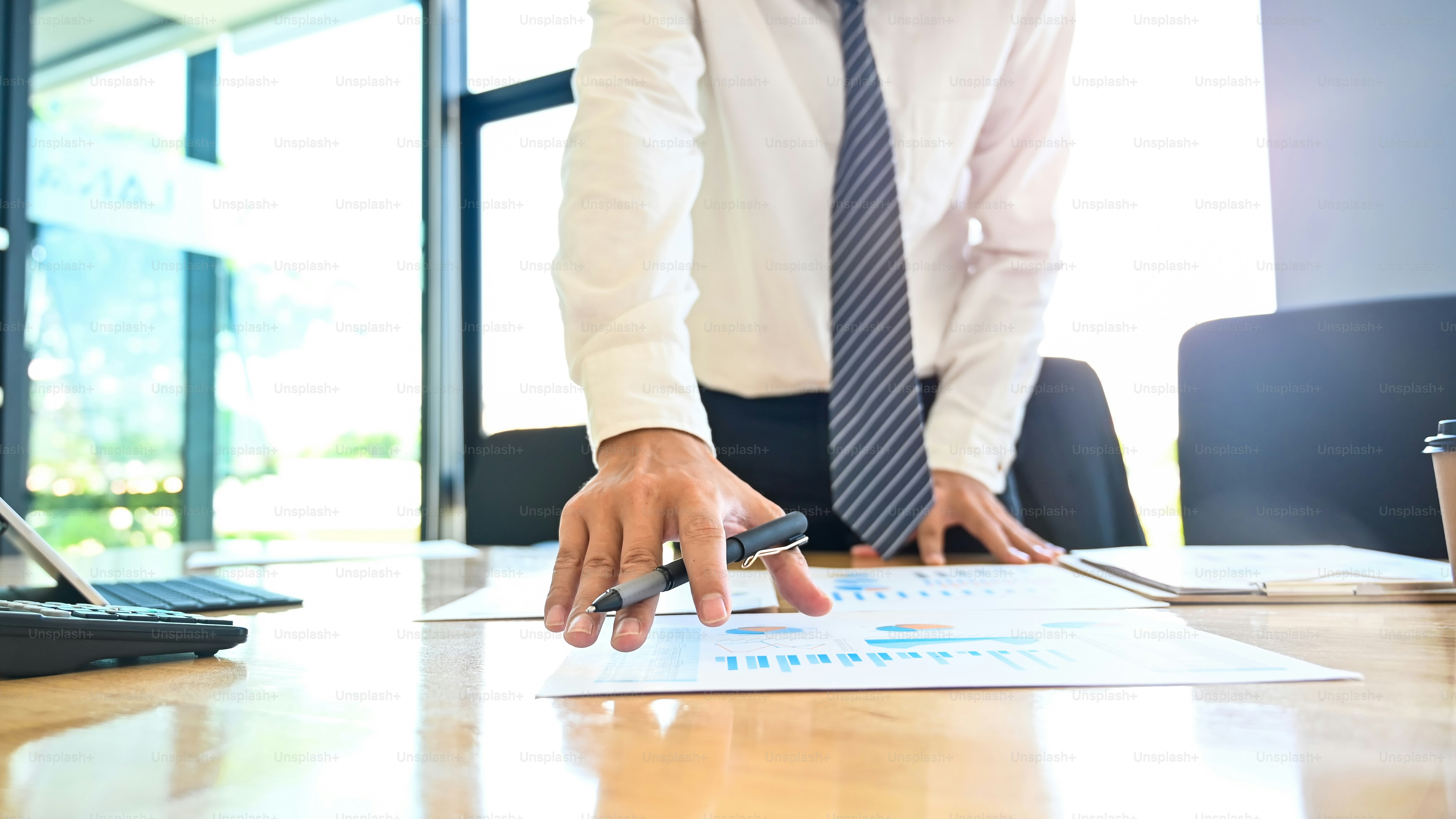 Audit financial working with finance data on table.