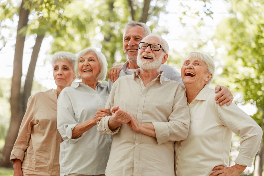 Happy senior people looking away and laughing stock photo