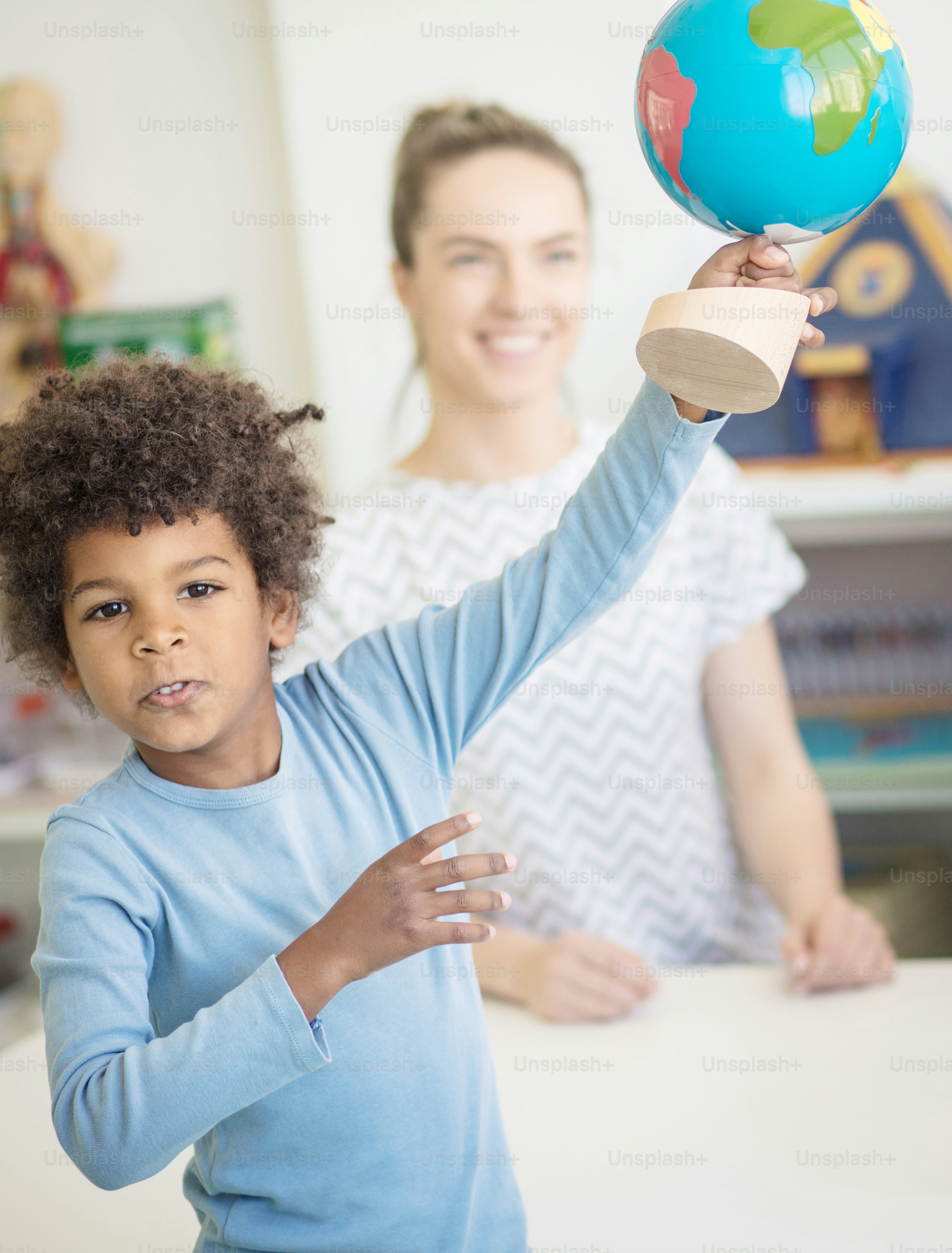 The whole world is mine. Child in preschool.