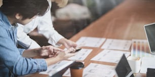 Cropped view of UI designer planing the UX application development with team members in modern workplace