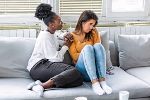 Two women talking about problems at home. Friendship consoling and care, unhappy girl support her girlfriend, copy space