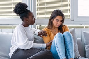 Two women talking about problems at home. Friendship consoling and care, unhappy girl support her girlfriend, copy space