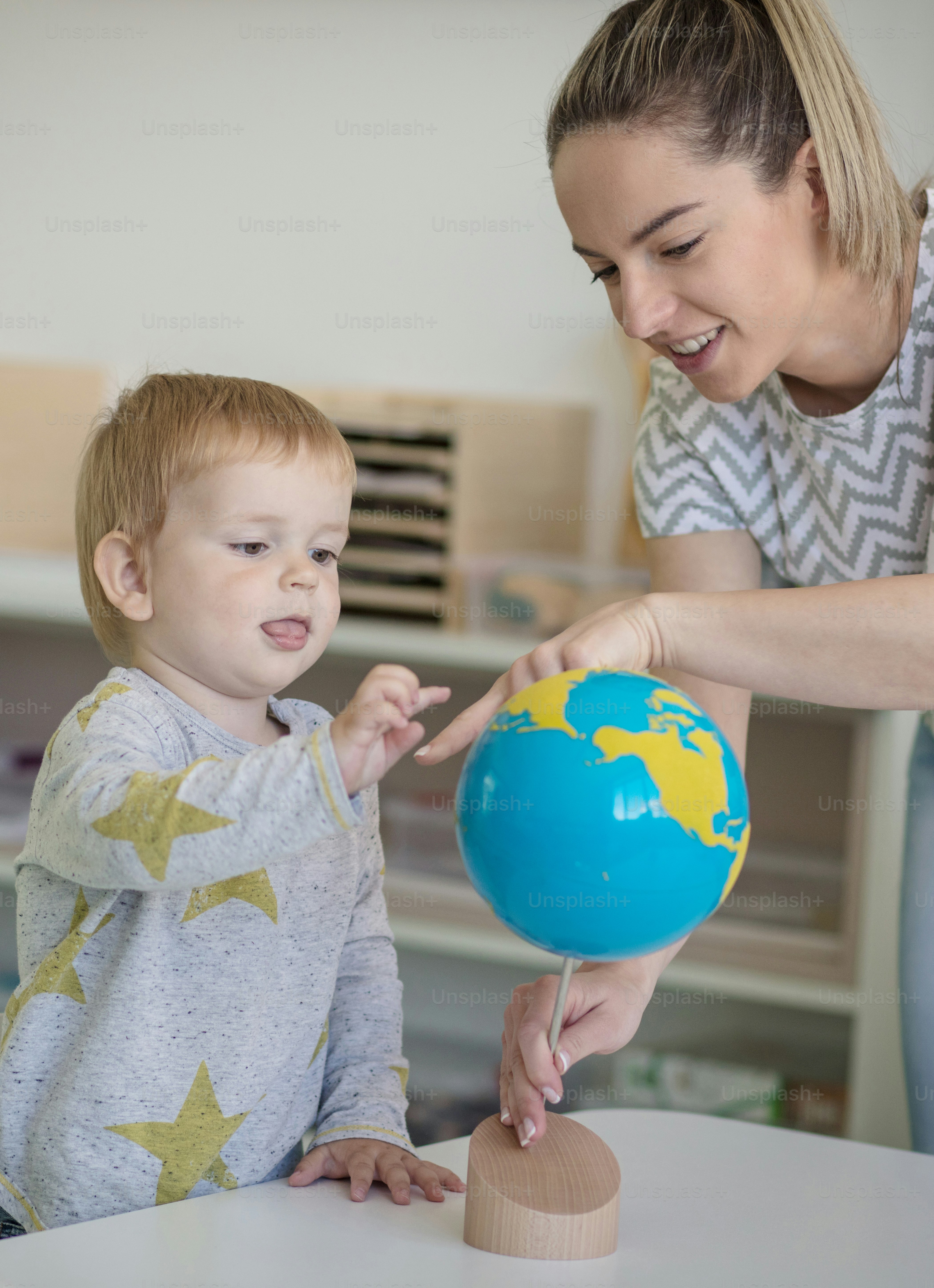 The whole world right in front of him. Child in preschool.