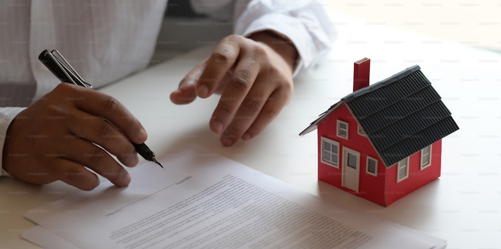 Property real estate concept : customer signing contract about home loan agreement for new house