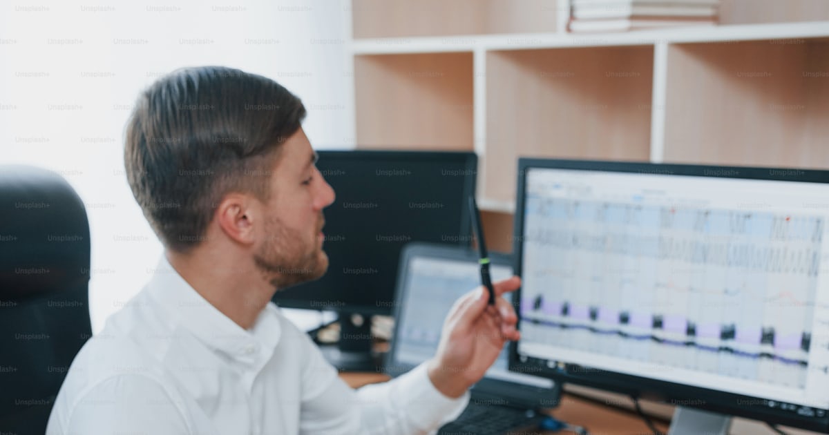 Vertical photo. Polygraph examiner works in the office with his lie ...