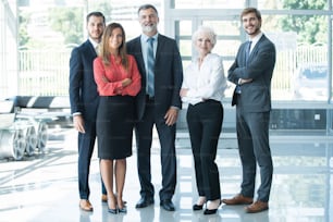 Group of businesspeople standing together in office