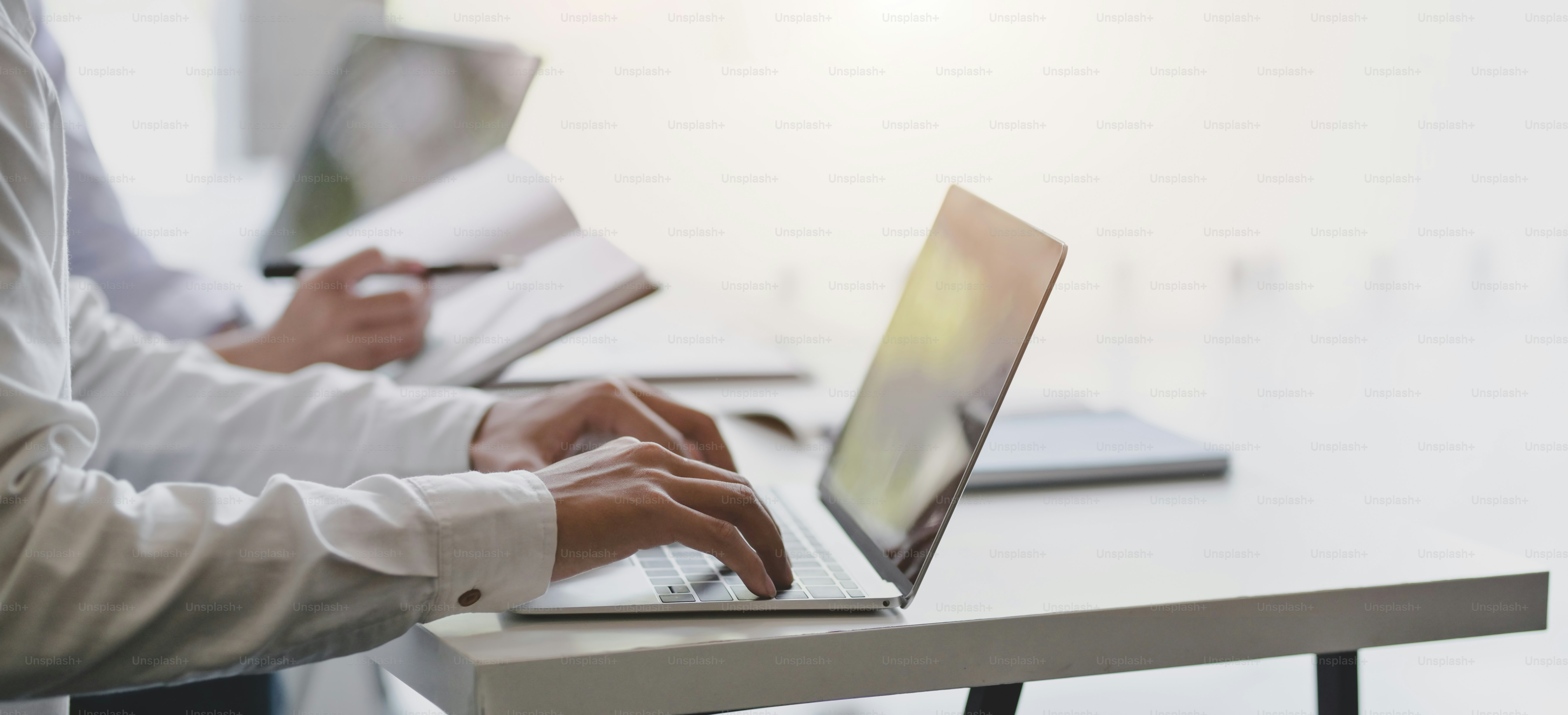 Cropped shot of professional business people working on their project with laptop computer
