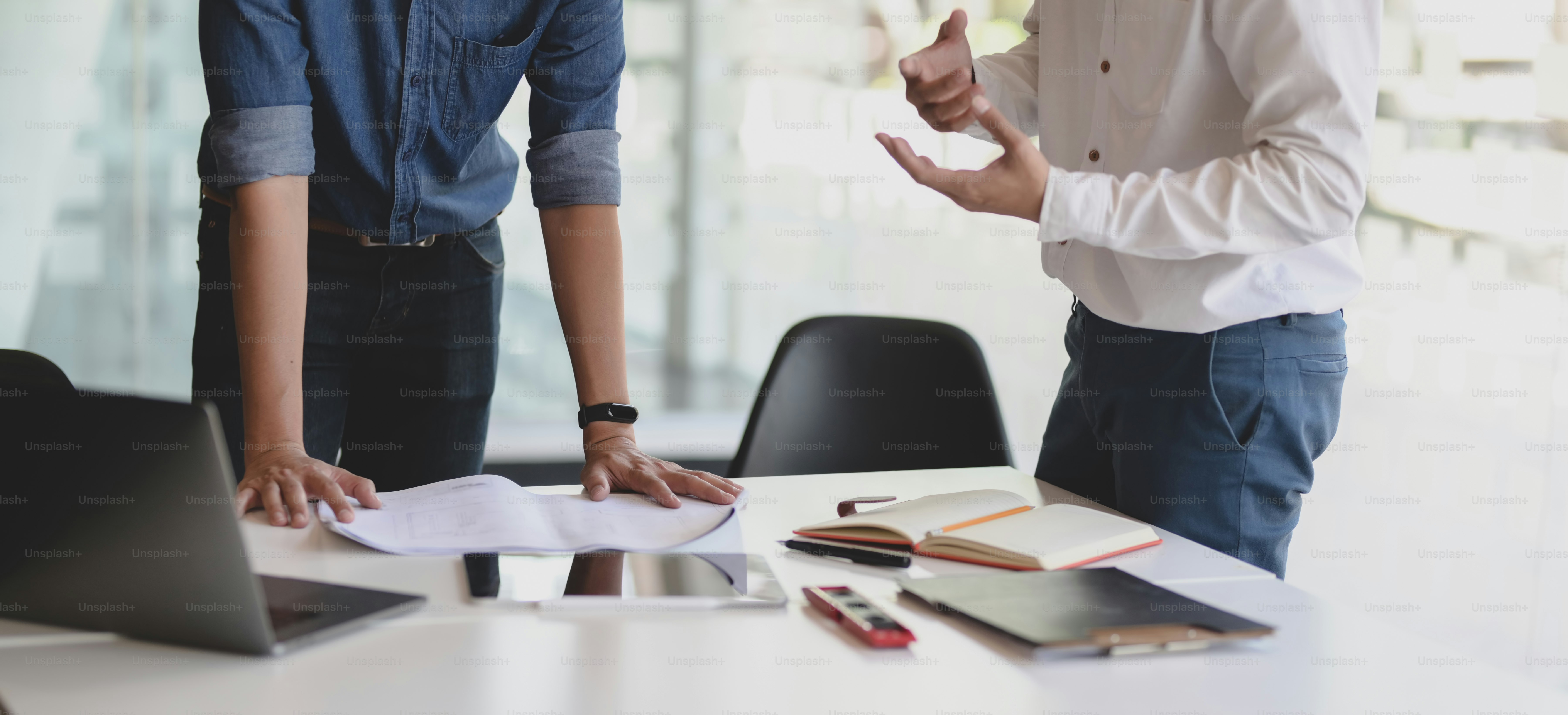 Close-up view of successful business team planing their strategy together in modern office room