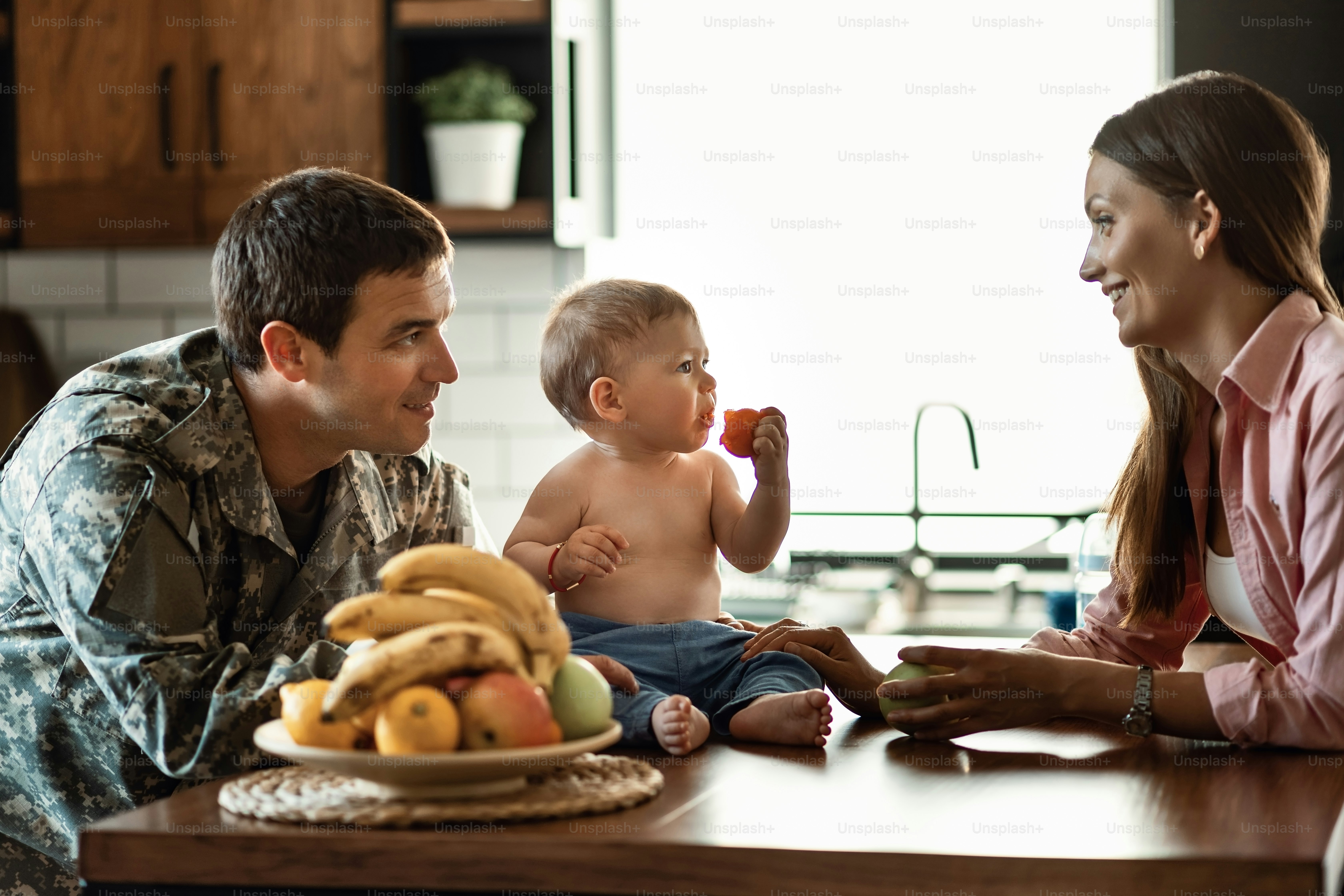 Smiling military family enjoying in their time together at home.