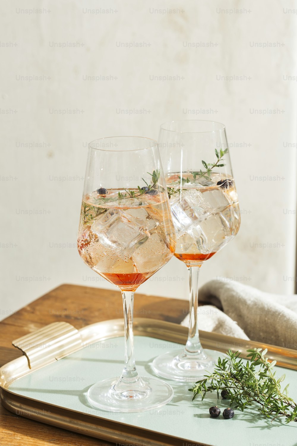 Prosecco cocktail, aperitif with Prosecco a white sparkling italian wine, bitter, thyme and juniper berries; Prosecco, lime and lavender; and Prosecco, orange and rosemary