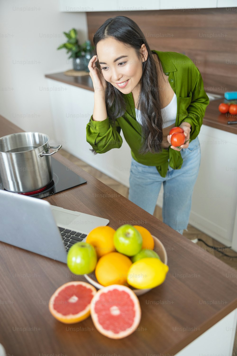 Focused young lady searching for a recipe in the internet