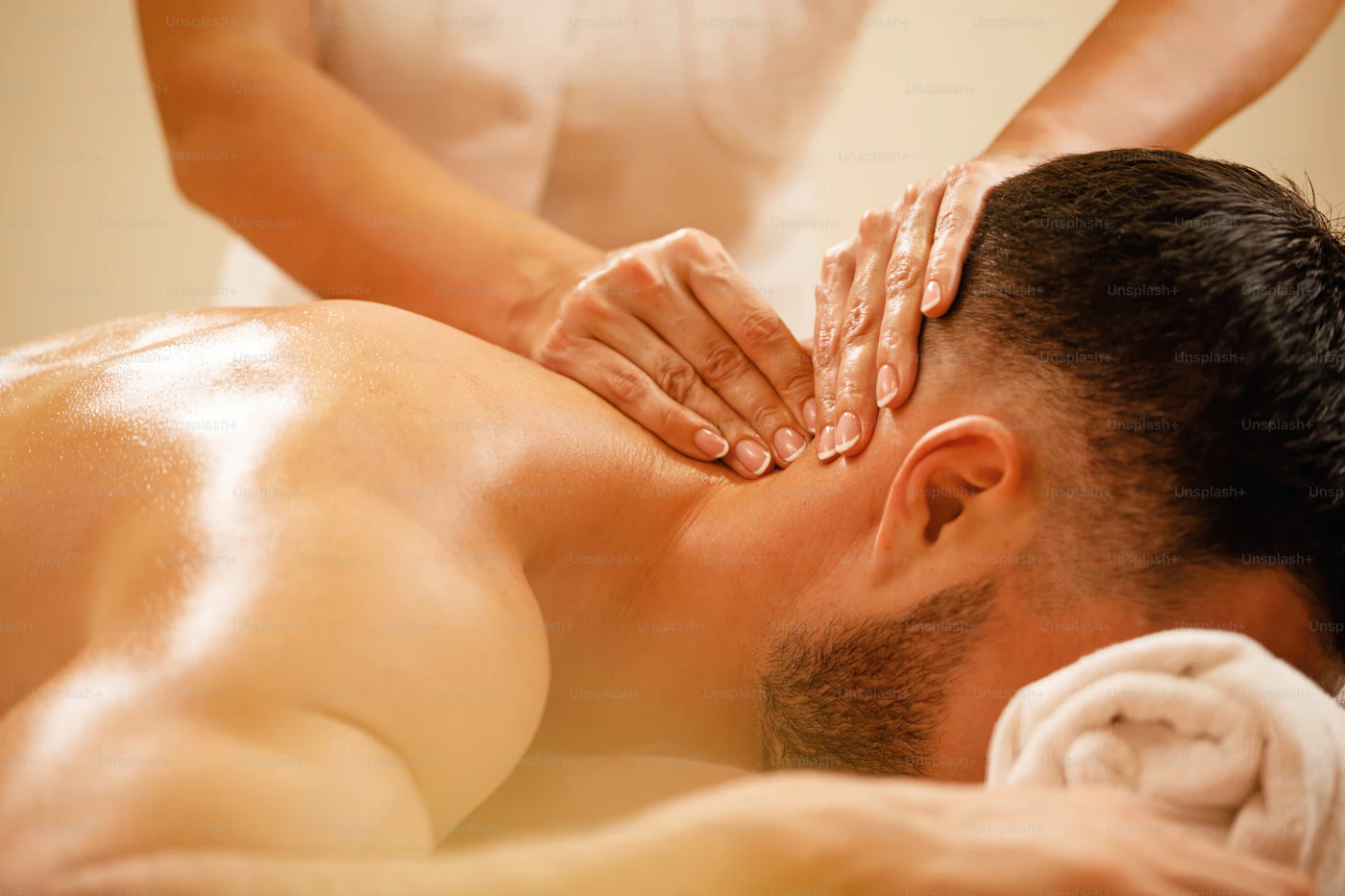 Relaxing head and scalp massage with therapist's hands