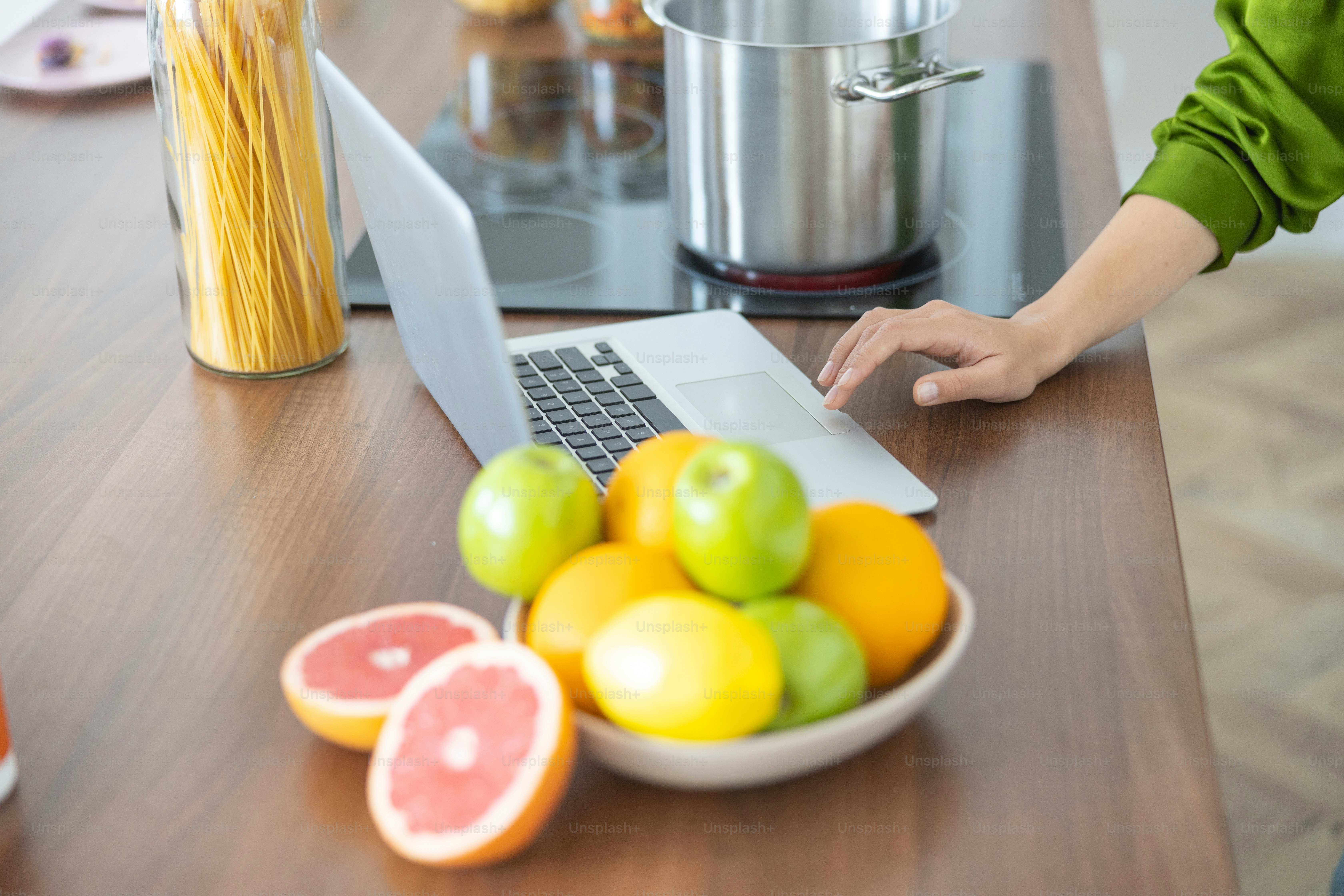Cropped photo of a female hand touching a touchpad photo – Kitchen ...