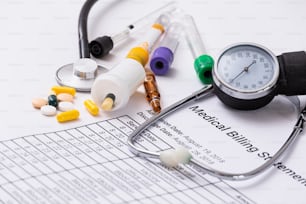 Medicine with colorful pills and stethoscope lying on Doctor workplace Health care costs concept picture Stethoscope and calculator on medical chart ,symbol for health care costs or medical insurance