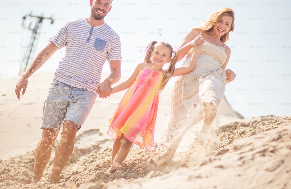 We found our place for vacation. Parents with daughter in desert.