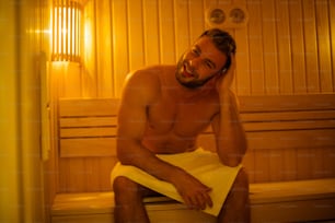 I enjoy my own way. Young man in sauna.