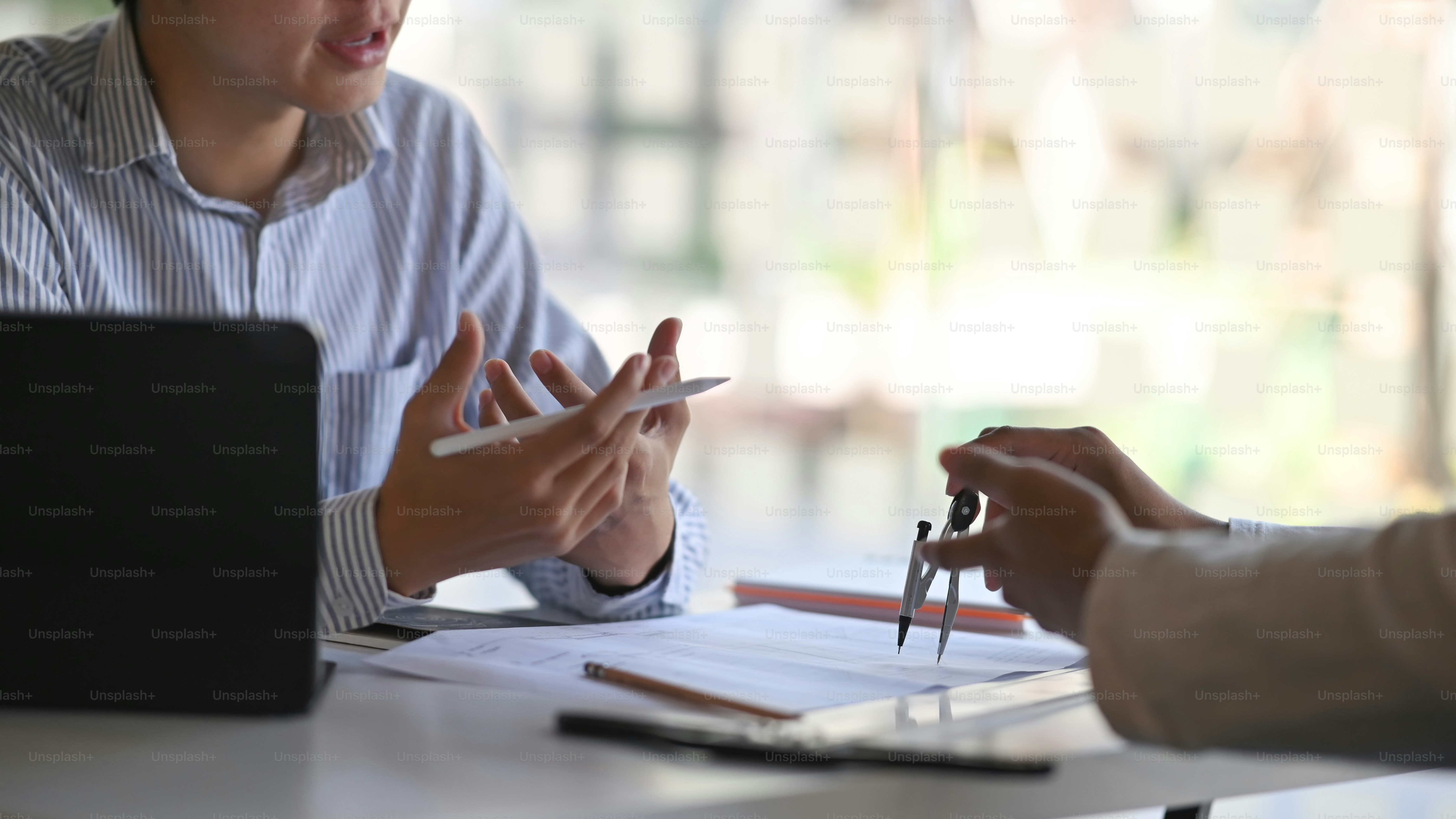 Closeup shot engineers drawing plan on blue printt with architect equipment.