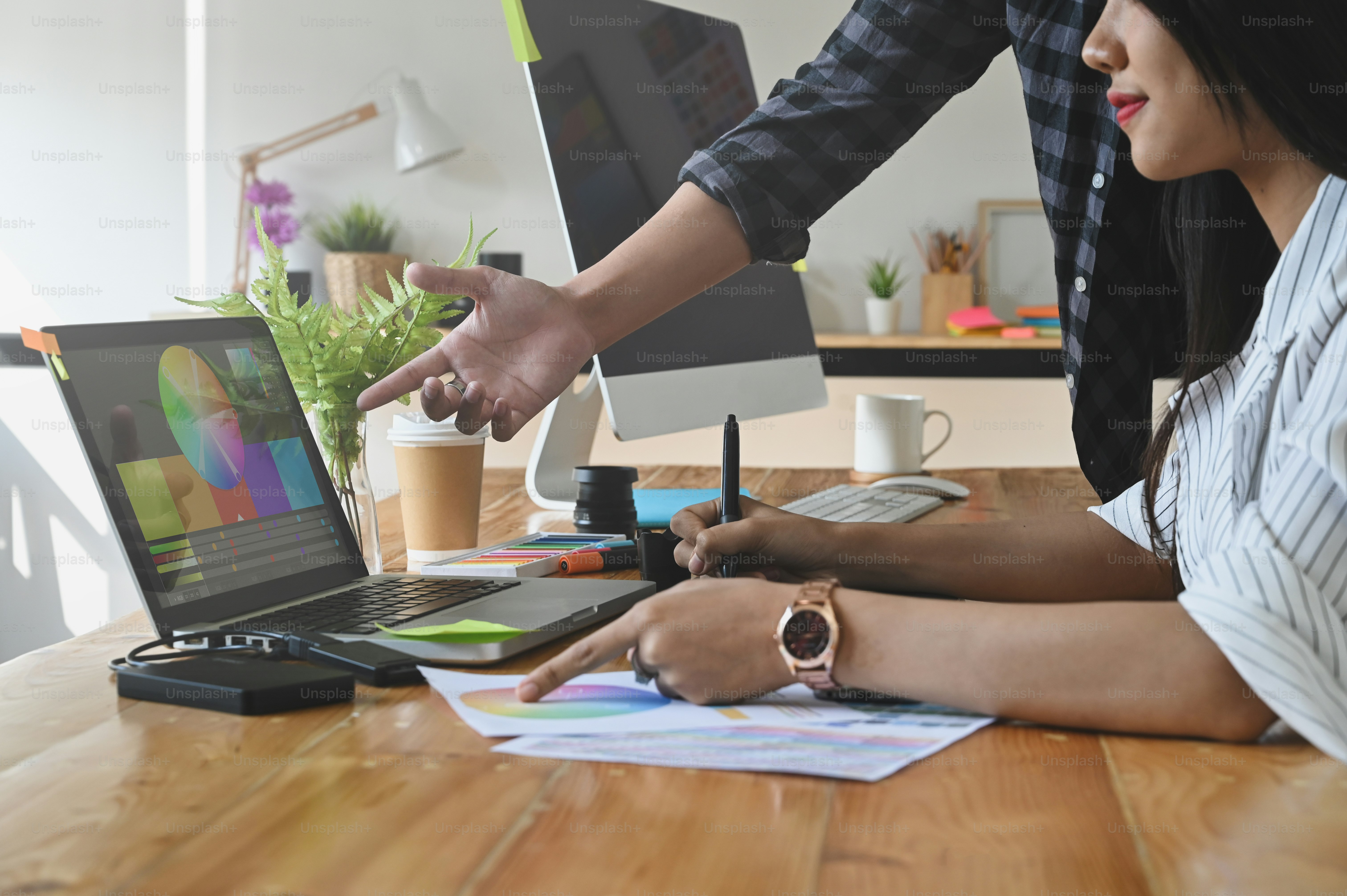 Graphic designer they meeting with laptop computer colouring meeting.