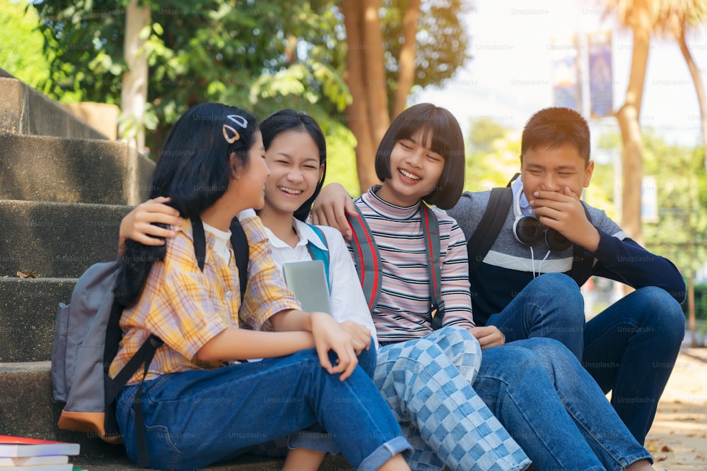 Group student young people and education reading book in city park