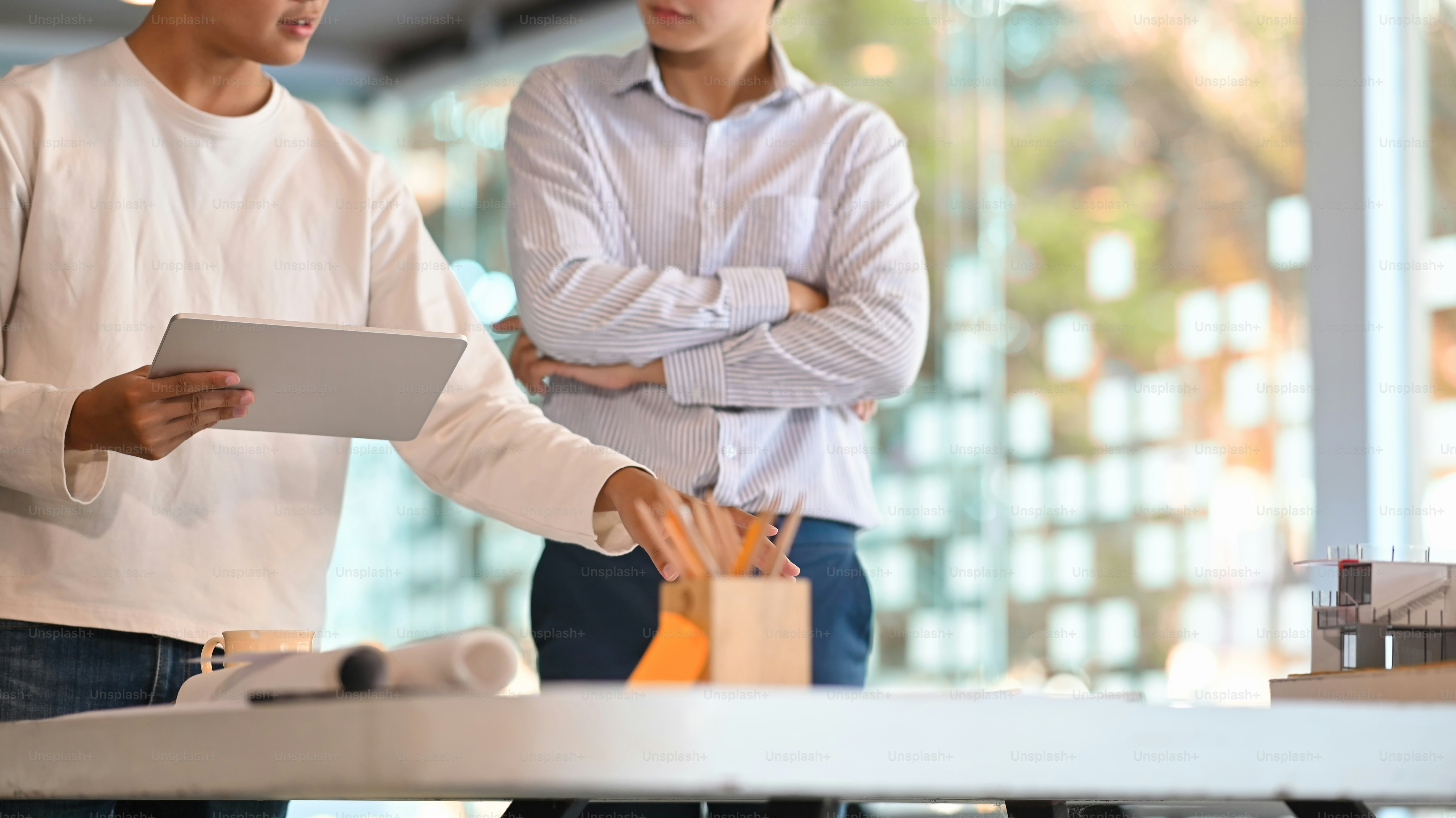 Cropped shot Brainstorming architecture they meeting with digital tablet.