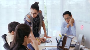 Unhappy business people in group meeting in office. The team is frustrated because of project failure. Business problem and crisis concept.