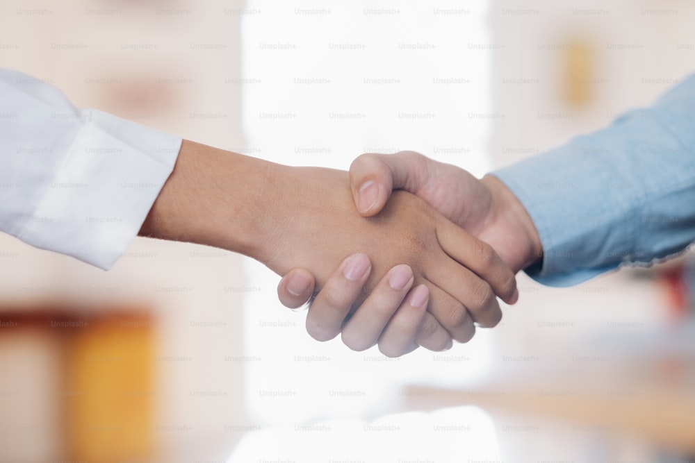 Businessmans handshake. Successful businessmen handshaking after good deal. Business partnership meeting concept.