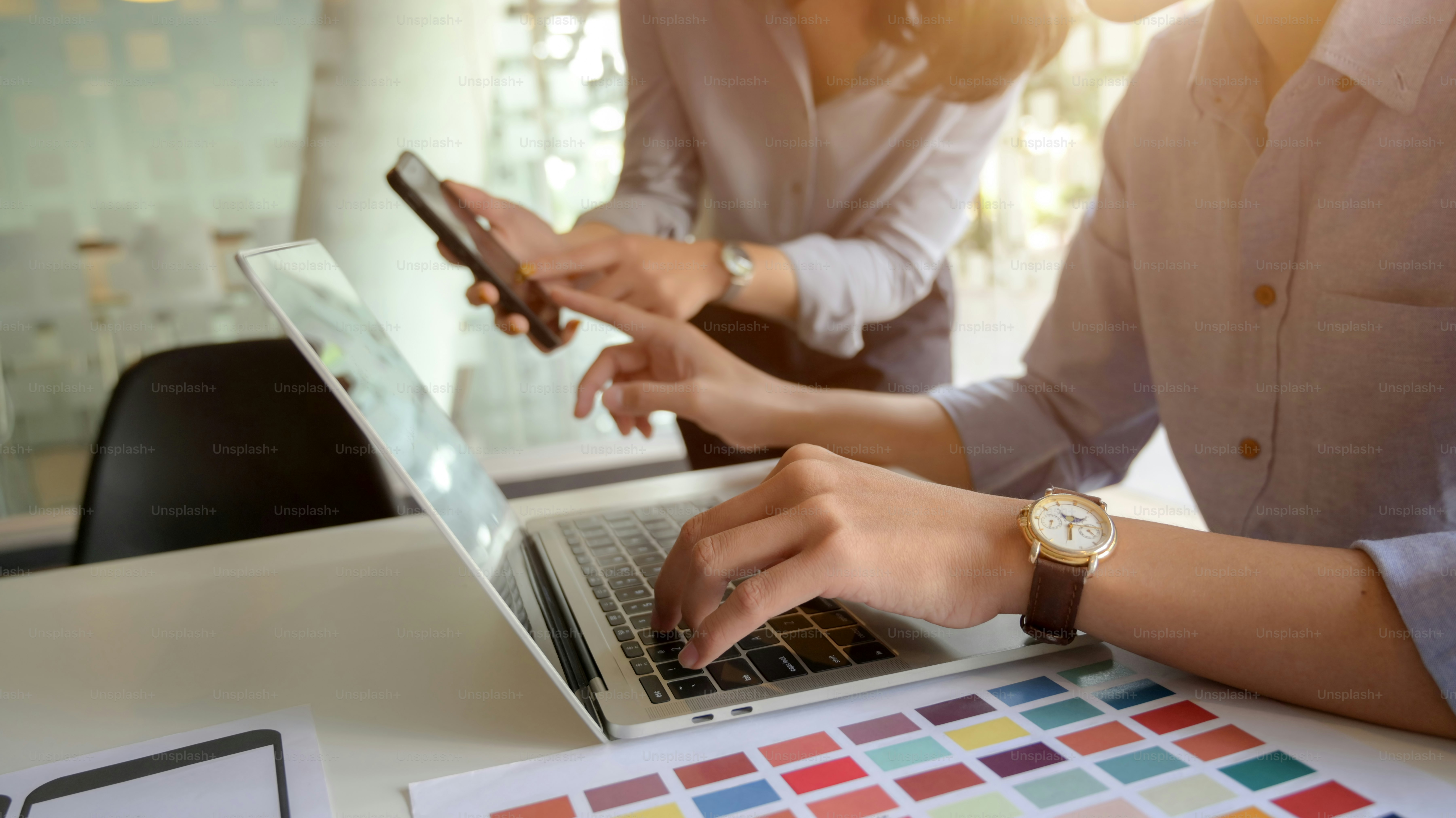 Cropped shot of young UI designer working on his project while typing on laptop computer