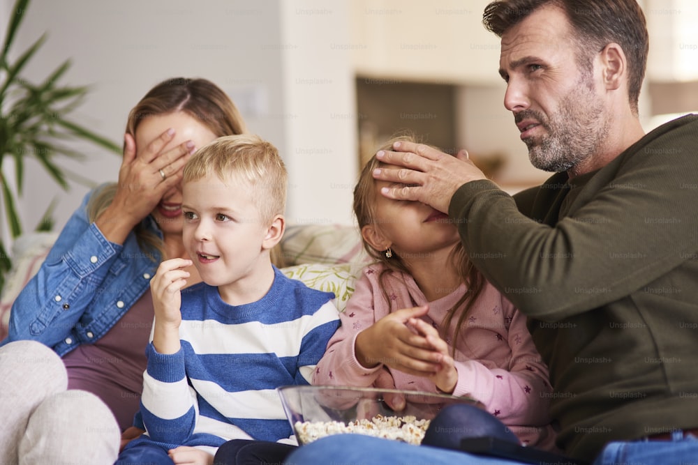 Scared family watching horror movies