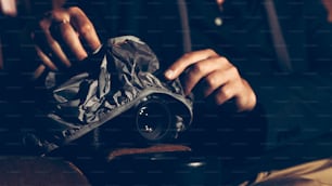 A man is secretly filming a video while watching a movie at the cinema