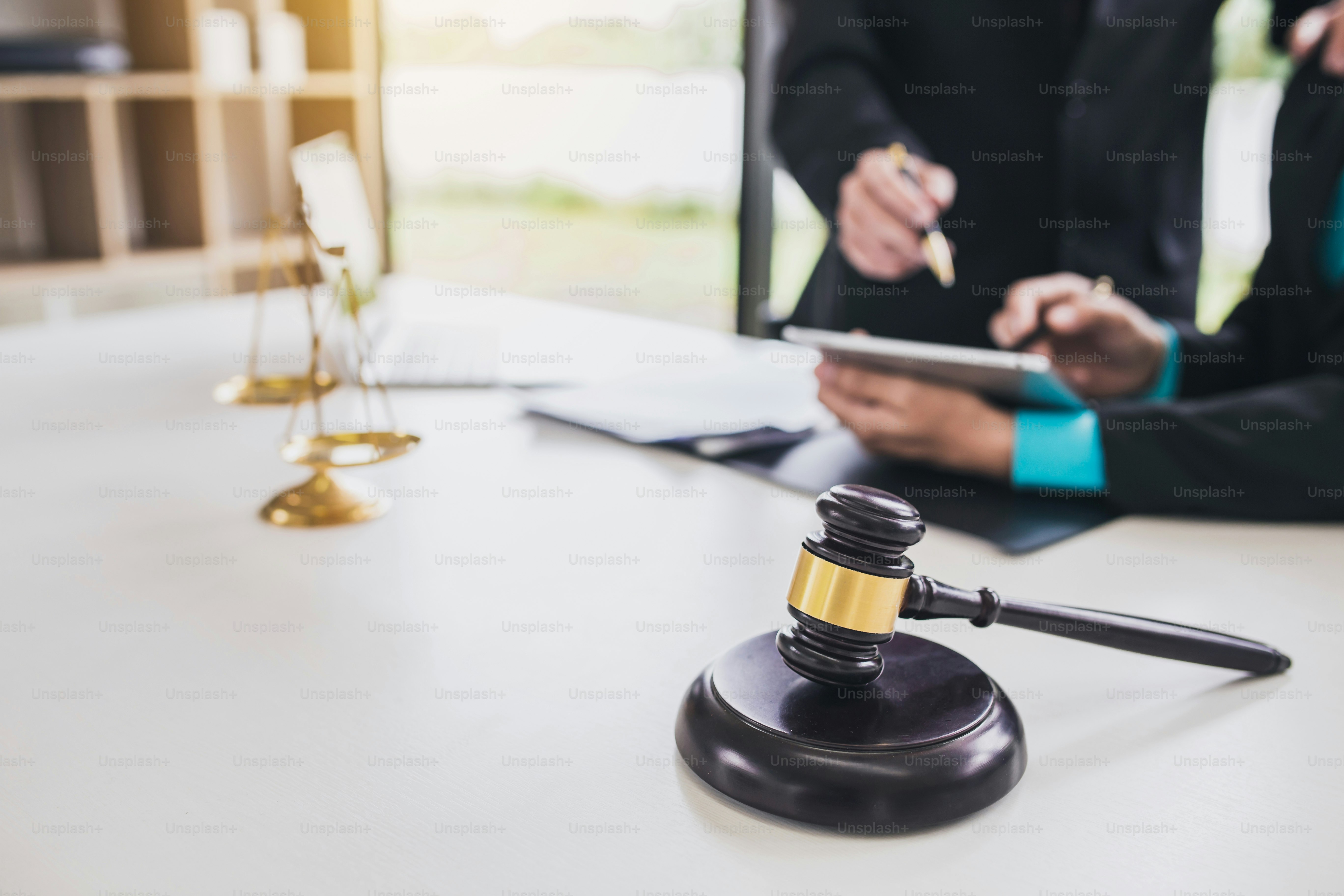 Lawyer advise his client in office.