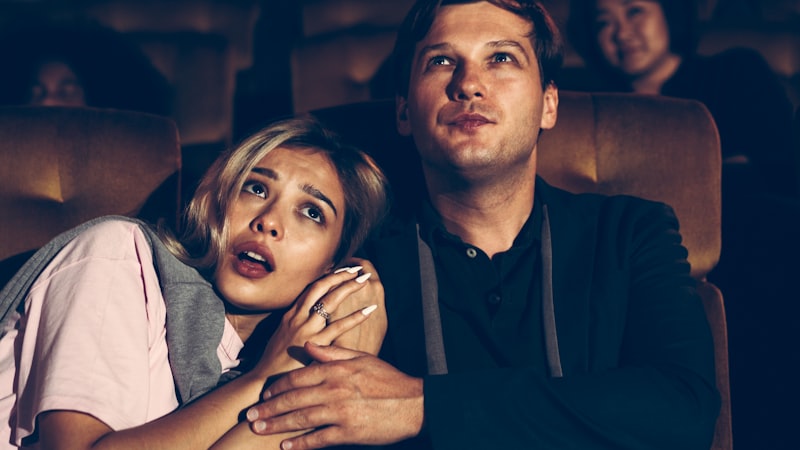 Demon Slayer movie poster, anime theater screening, cinema audience, Japanese movie theater