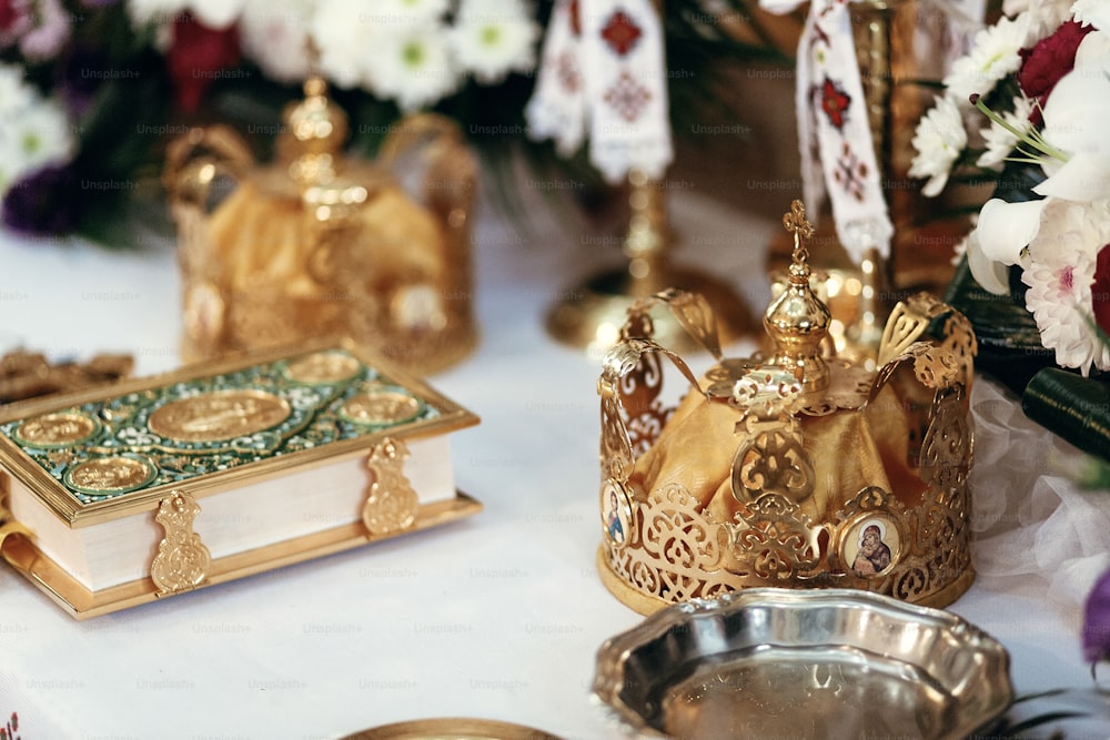 golden crowns and holy bible on altar in church at wedding ceremony, spiritual place, religious moment