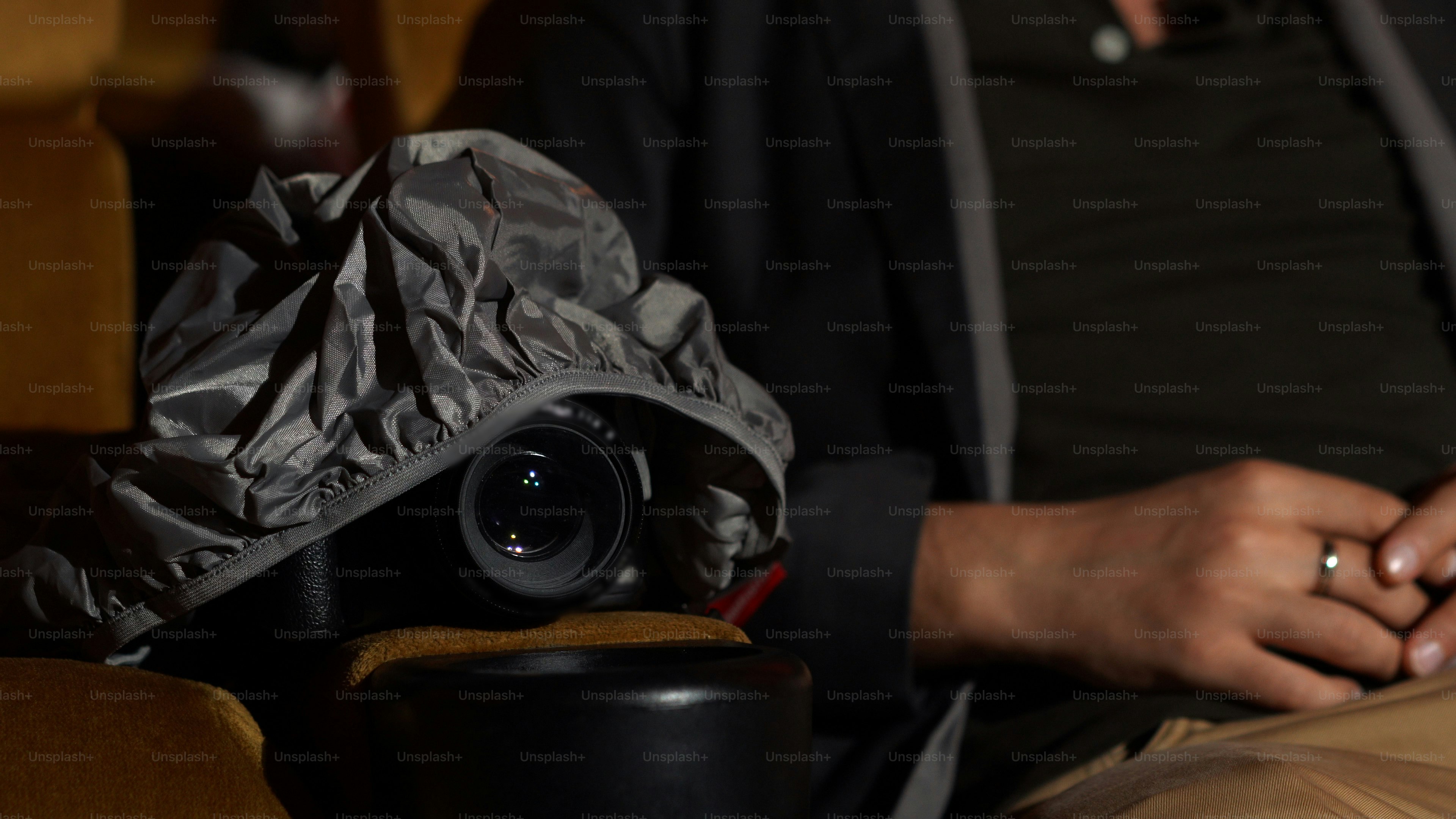 Backpacker using weather protection as part of backpacking gear protection strategy