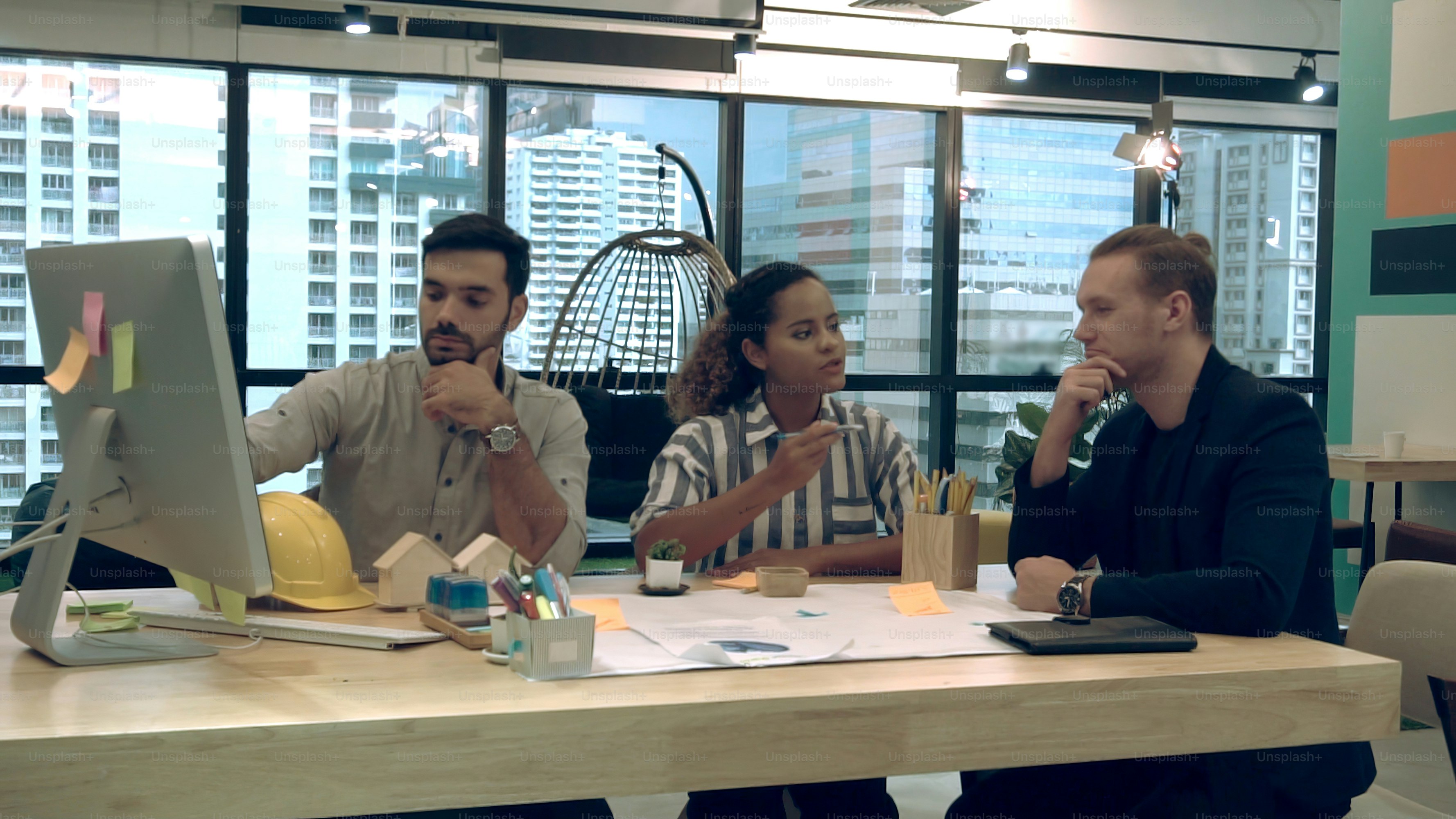 Creative business people group having conversation at office desk in modern workplace. Corporate international business concept.