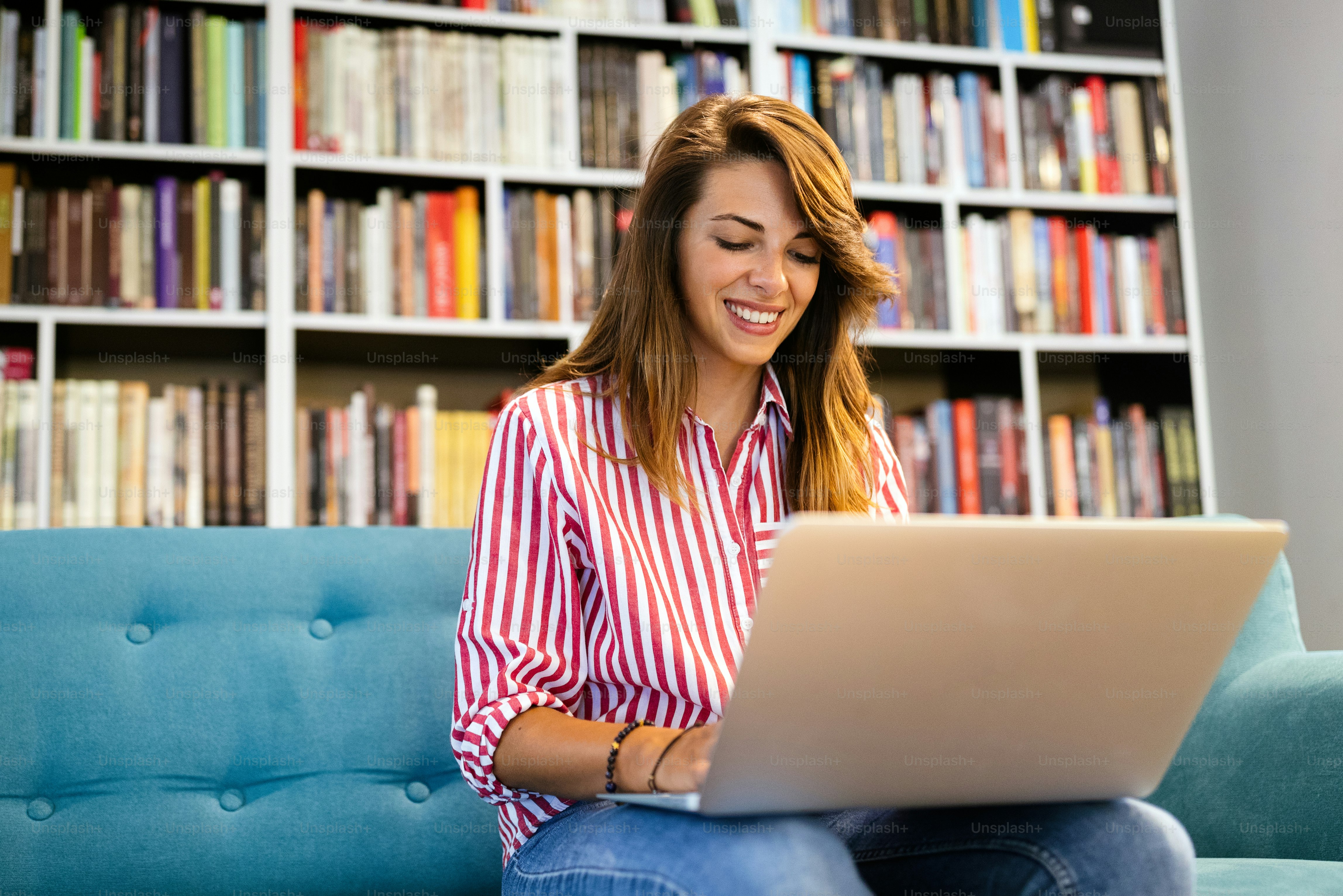 Young woman receiving good news on her tablet