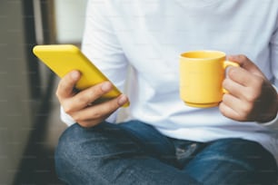 Young man using mobile phone. Using online connect technology for business, education and communication.