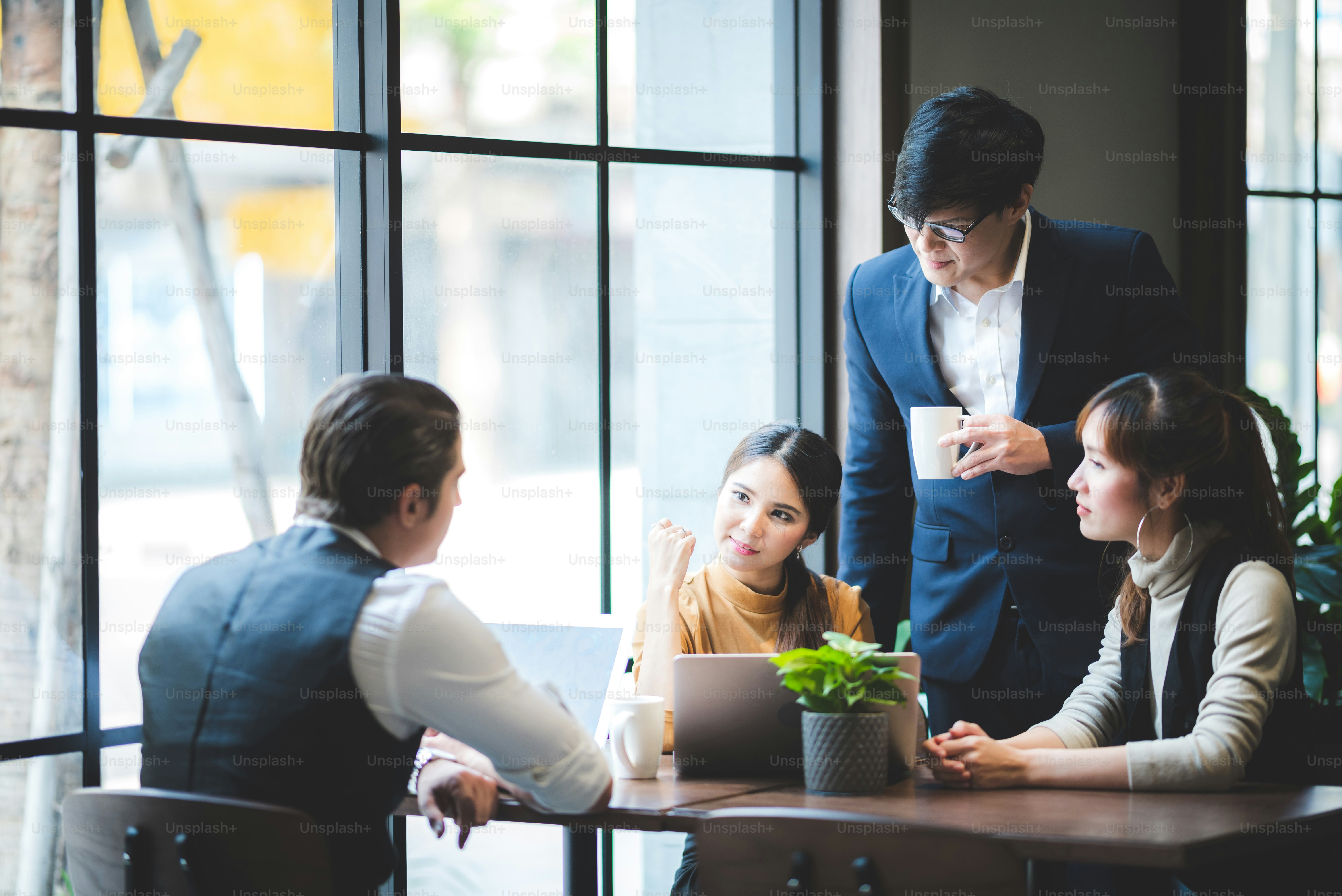 Successful business group of people at work in co-working space office ...