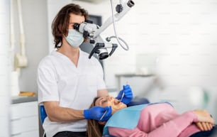 A woman has an annual dental check-up in dentist surgery.