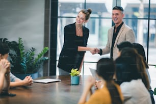 business partners meeting in modern office, coworking space