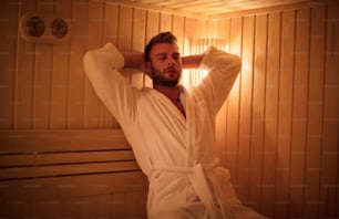 Just relax. Young man in sauna.