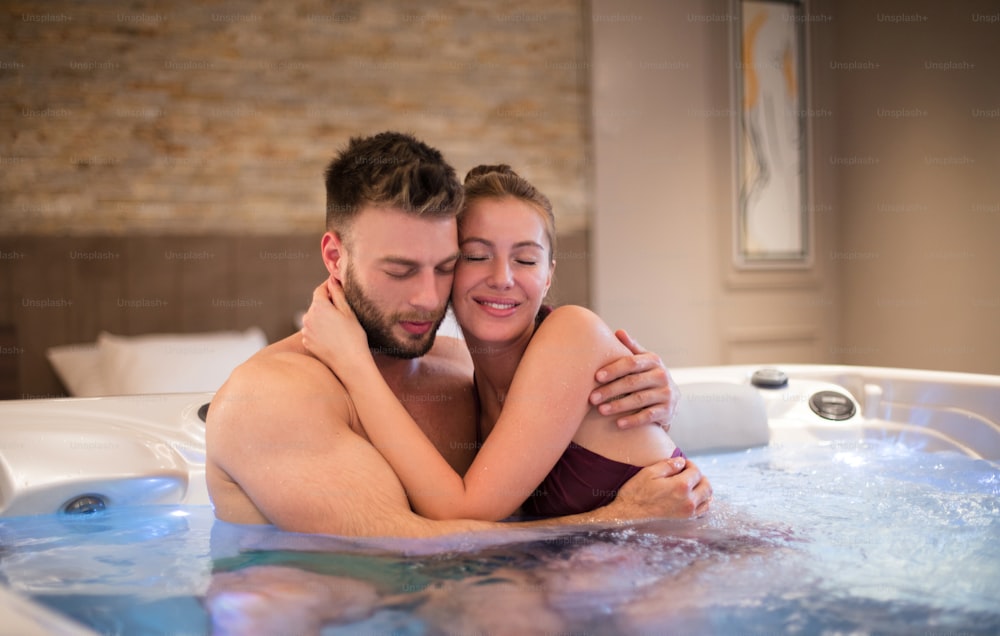 Love is beautiful when shared. Couple in hot tub.