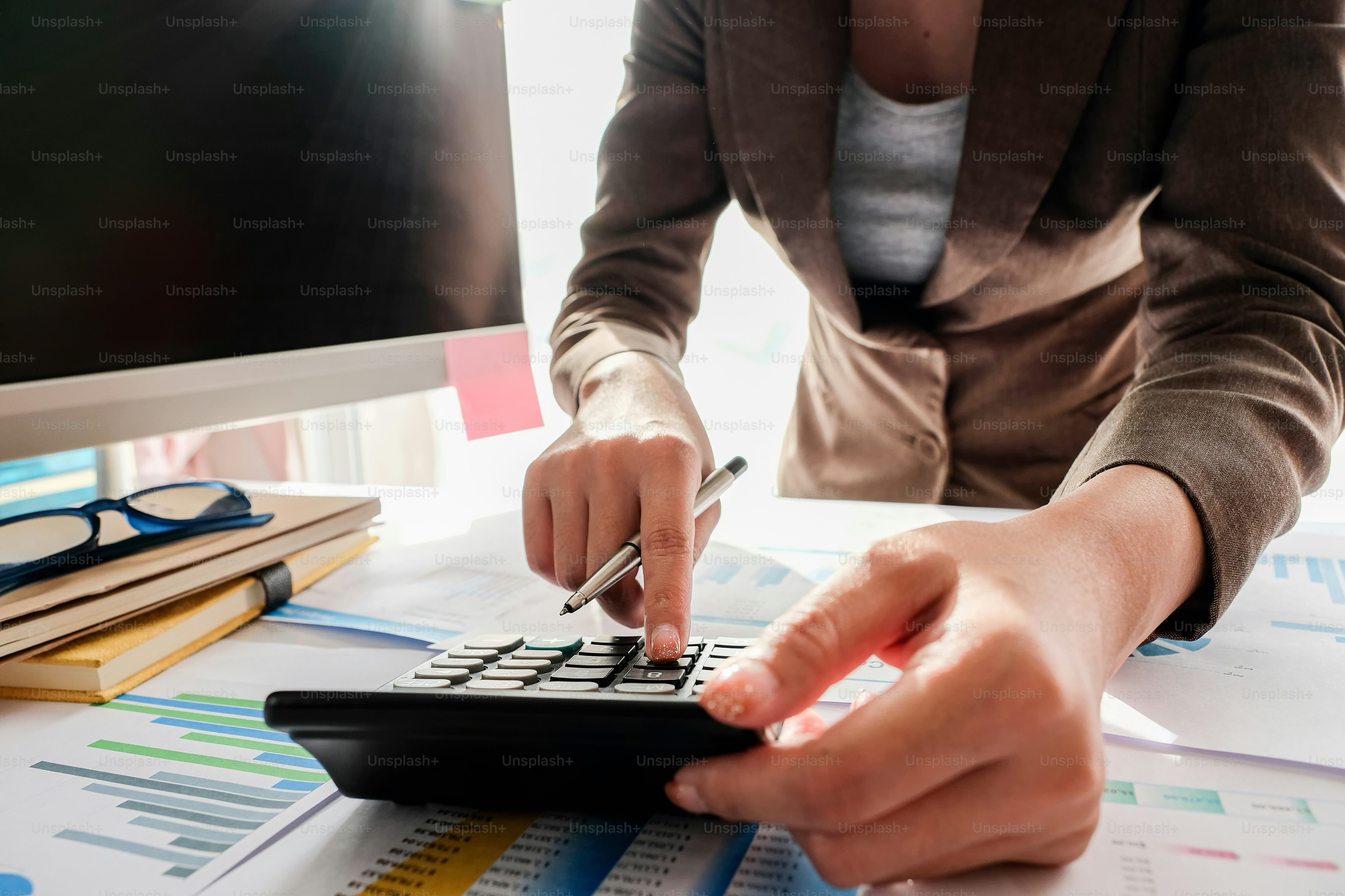 Businessman Accounting Counting with calculator and financial document report at home