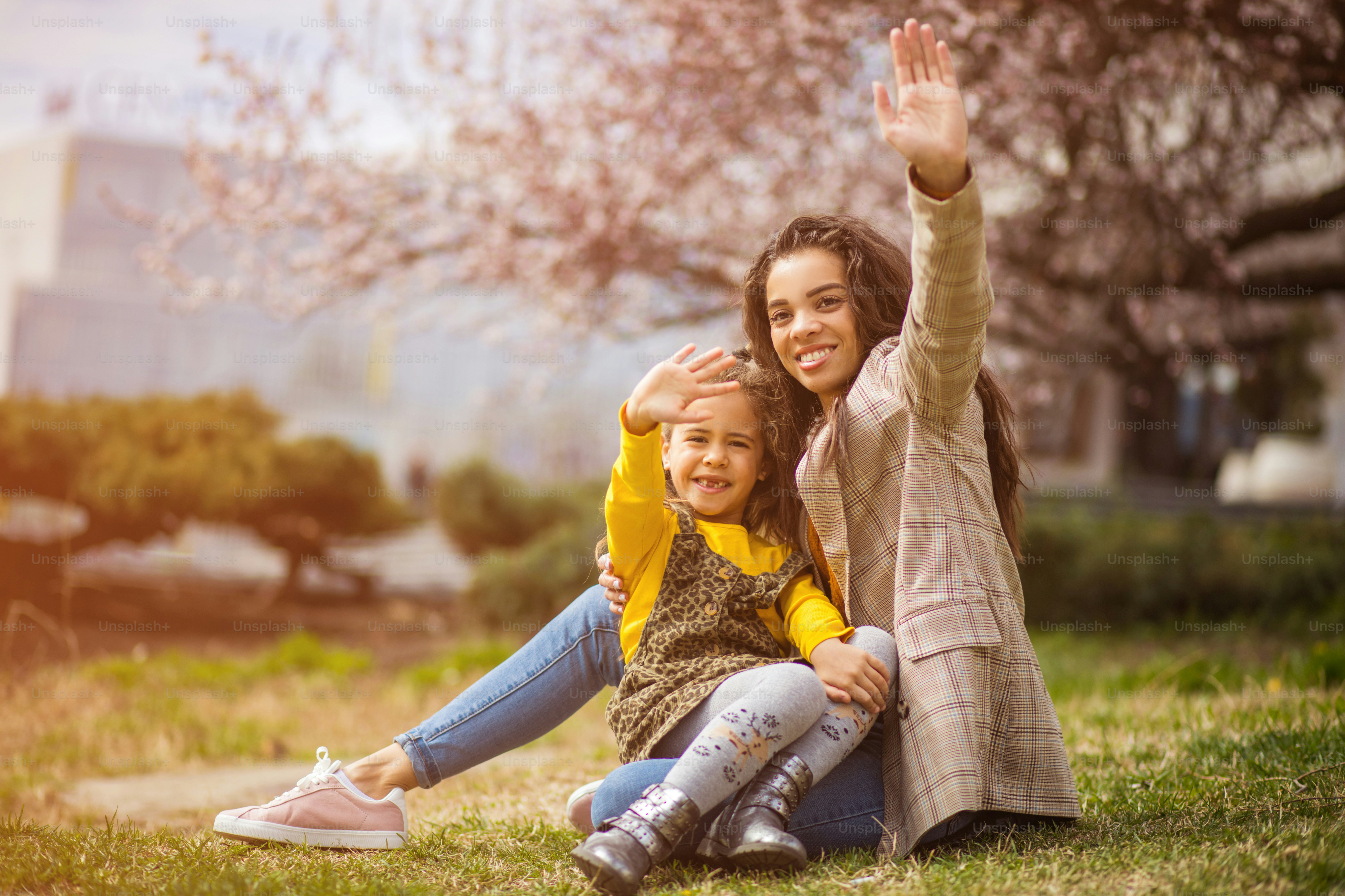 Hello. African American mother with her daughter at the park.