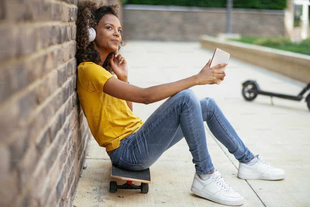 Young african woman outdoors. Beautiful young woman enjoying outdoor.